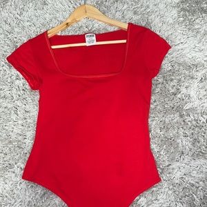 A body suit from Victoria’s Secret pink, color red, in size medium